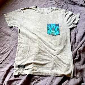 Phish merch t-shirt, grey with concert graphic pocket. Size medium.